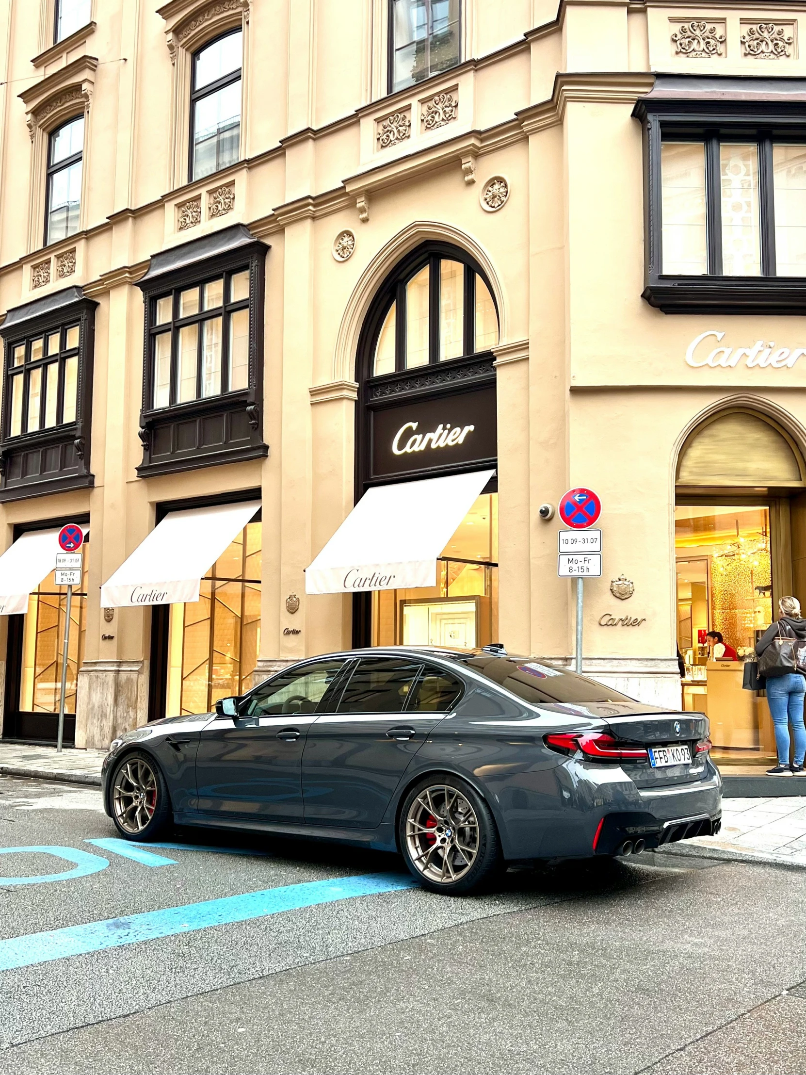 a car parked outside of a large store