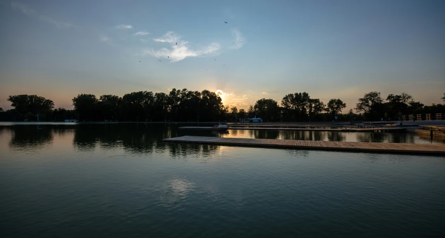 an outdoor dock in front of the water