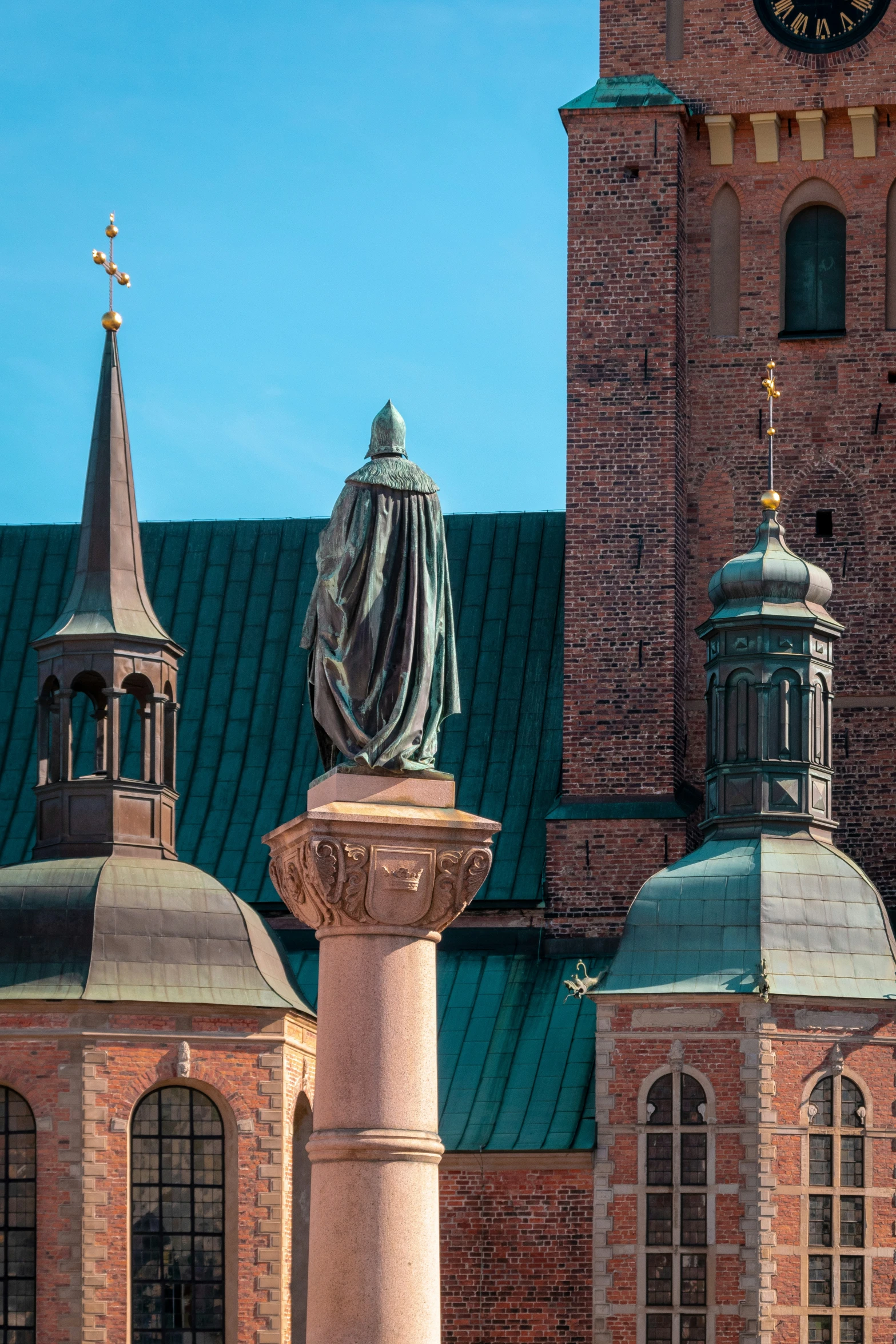 an old building with a statue on top