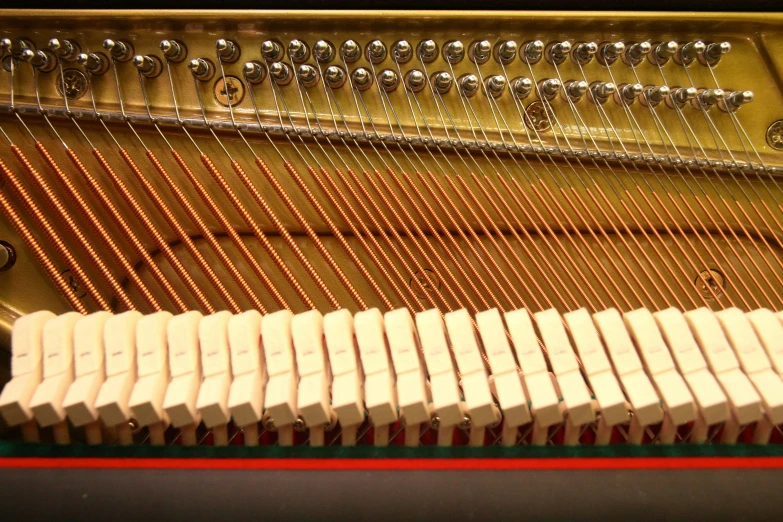 a piano is being played while the strings hang