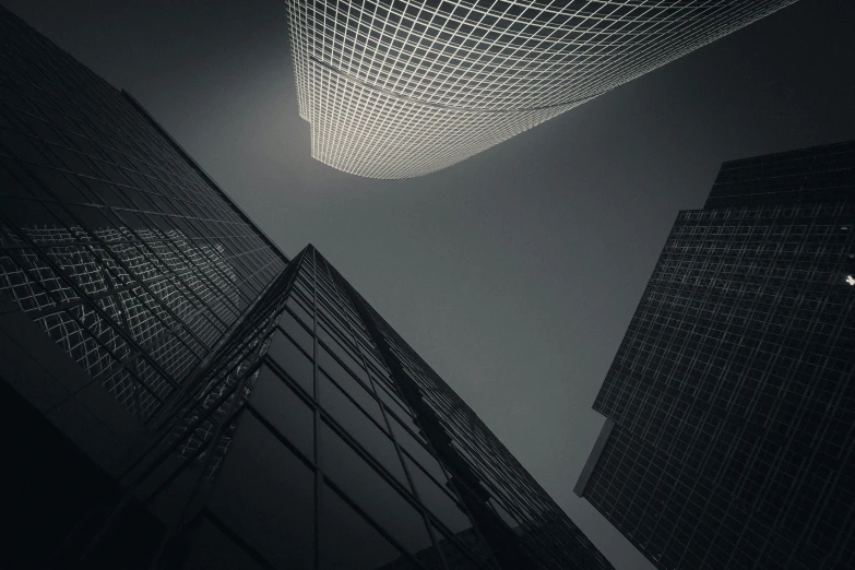 two tall buildings with light streaks on the sky