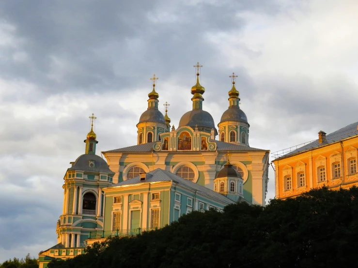 an old church is shown during the sunset