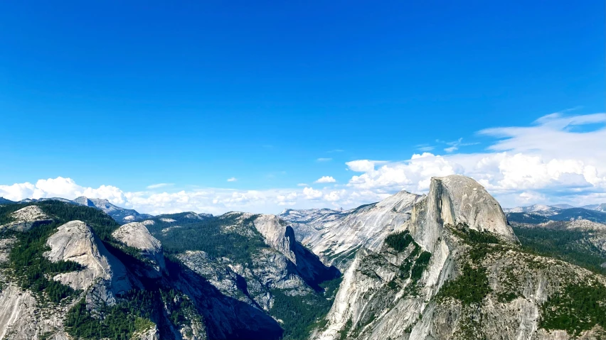 a clear blue sky is over a rock formation