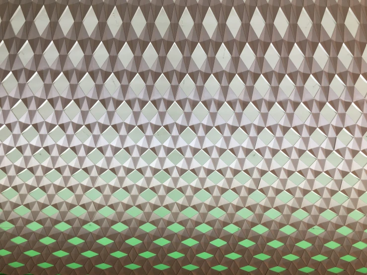 an image of geometric art that is made with green squares and white triangles