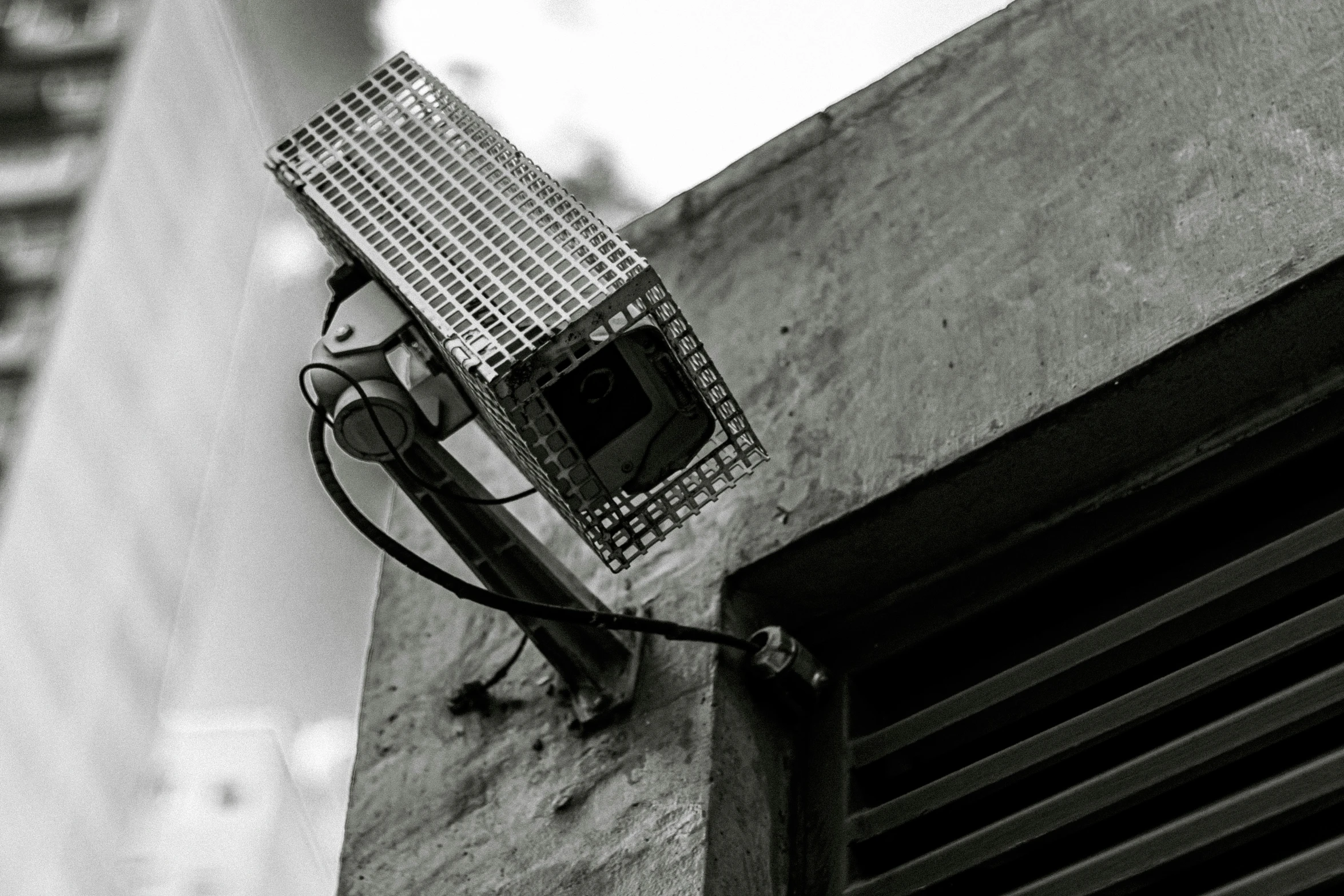 a telephone phone hanging on the side of an apartment building