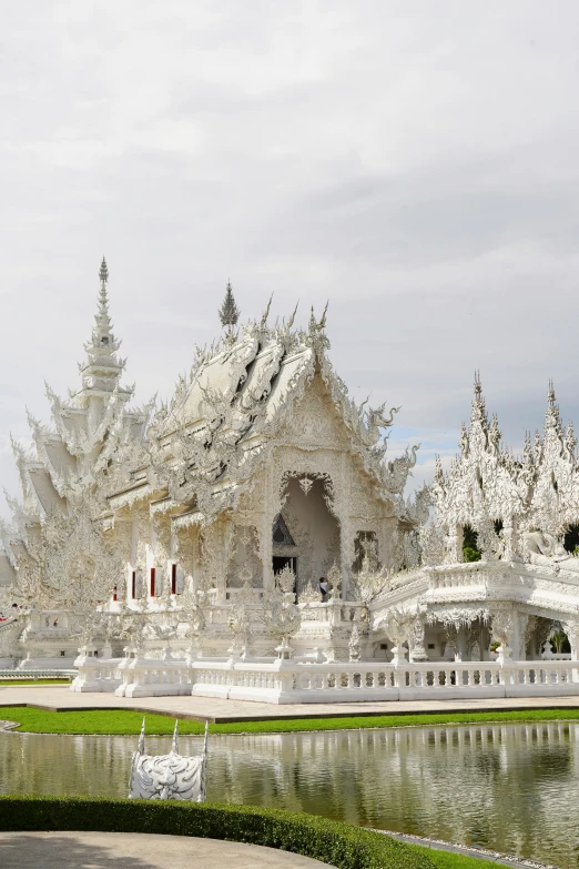 a view of a palace that is next to a lake