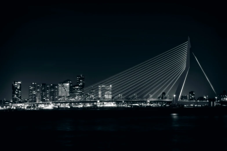 night view of a very long bridge with lights on