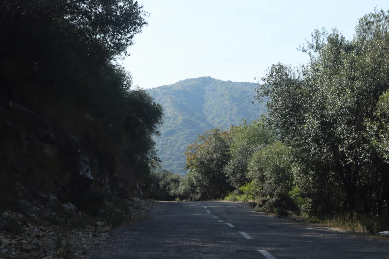 a view of a road from the top of a hill