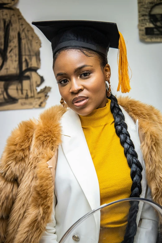 a woman is wearing a graduation cap