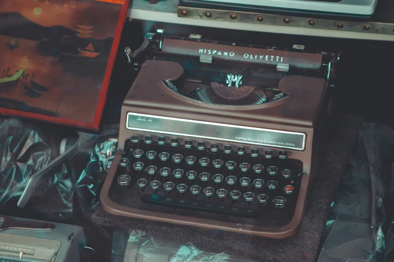 an old style typewriter is next to an older typewriter