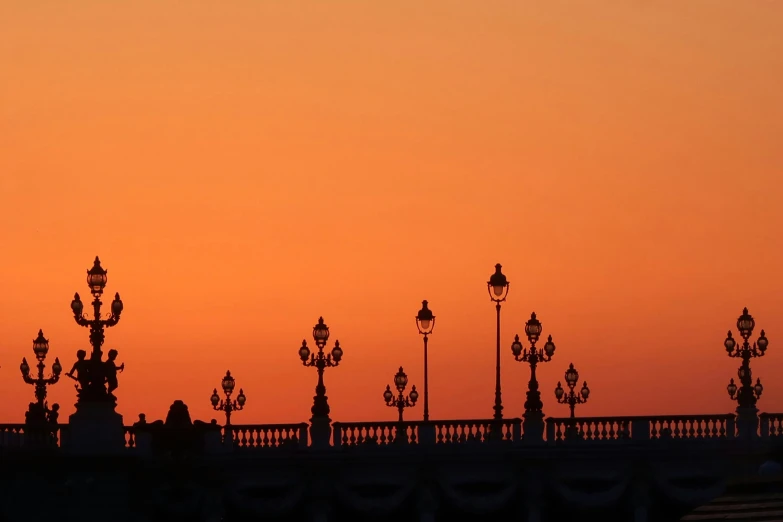 a beautiful view of a very tall building and a sunset