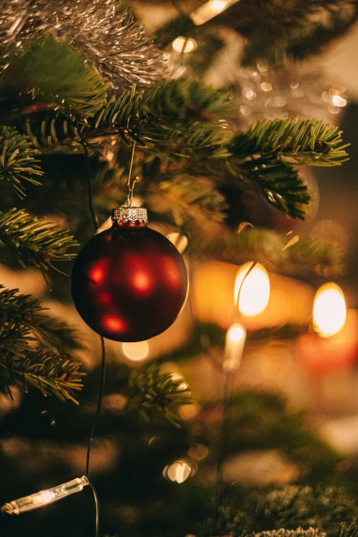 close up view of a christmas ornament hanging from a tree