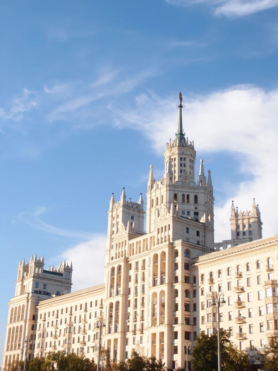 an old white building is set high on a clear day