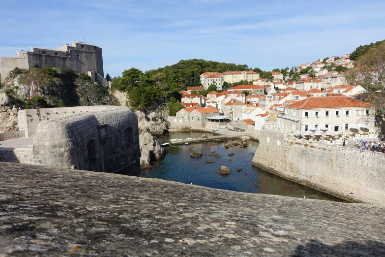 a small river in front of old buildings