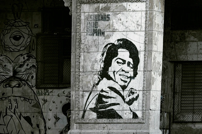 a picture of a black and white woman on the side of a wall