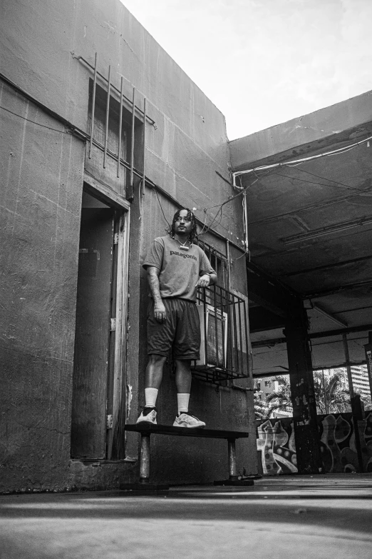 a man standing in a doorway with a suitcase