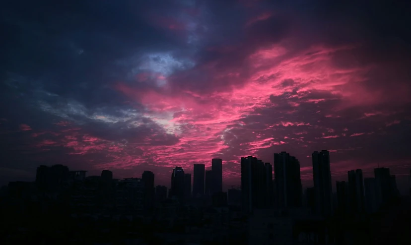pink sky over a city with skyscrs