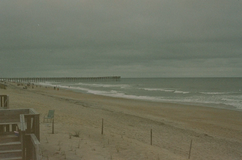 a beach scene with waves coming in to the ocean