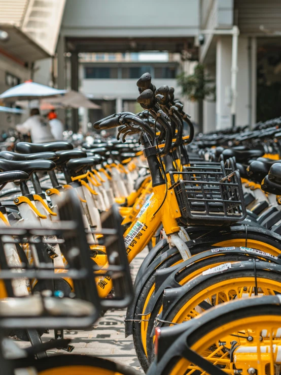 bicycles lined up on the side of the street