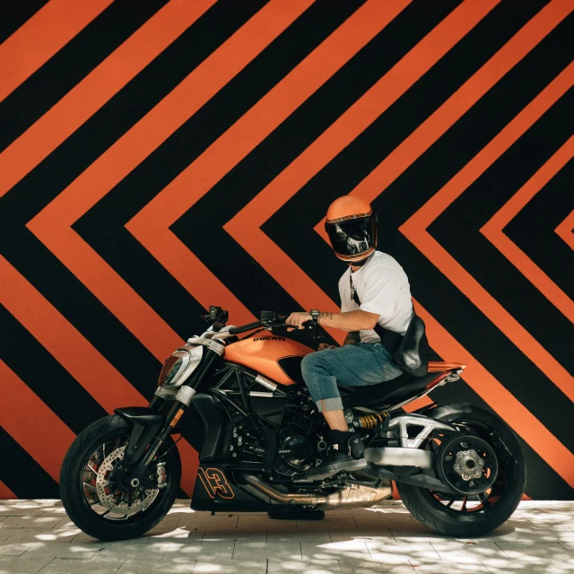 a man sitting on top of a motor bike