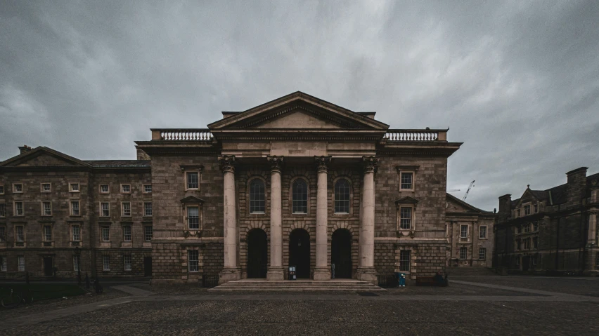 the large building has two columns on it's roof