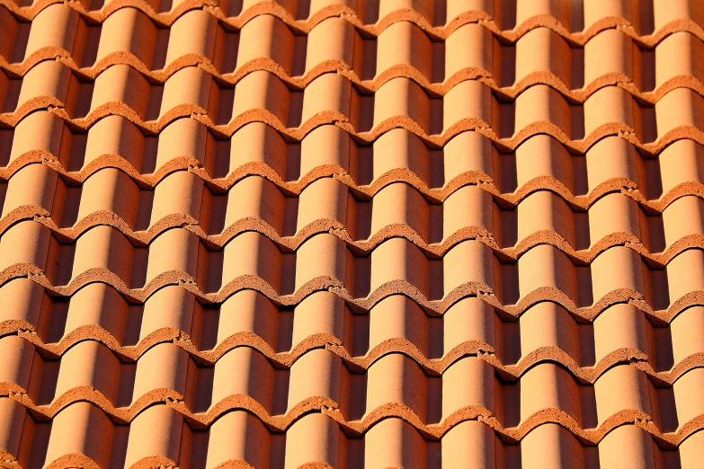 a lot of red clay tiles with an uneven pattern