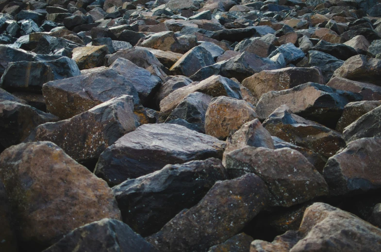 lots of rocks piled together in the middle of a field