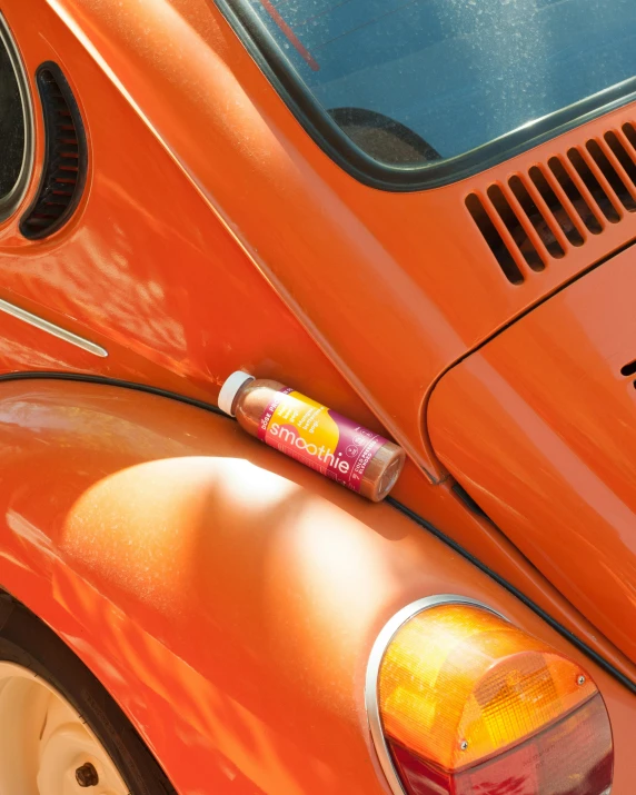 a closeup of a red vw bug bug