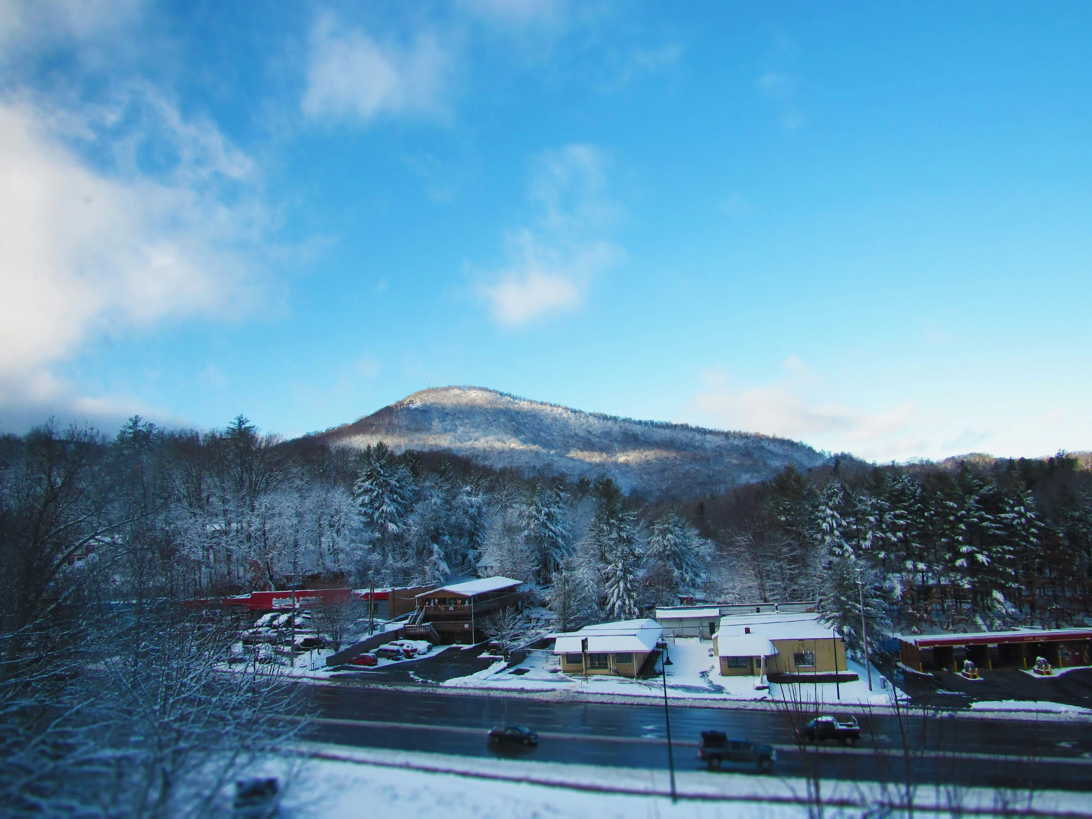 a snowy town on a hill on a clear day