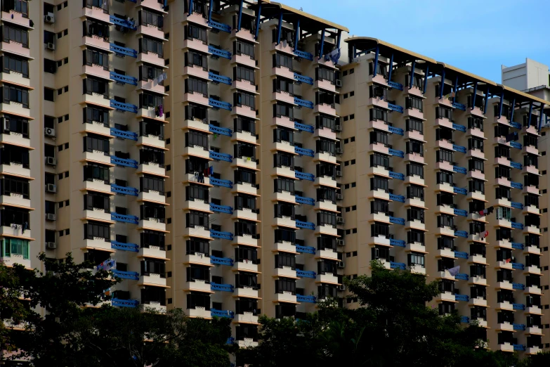 a tall building with several windows and balconies