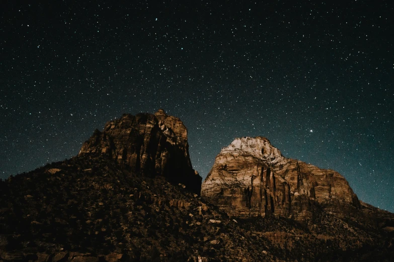 two tall mountains under a very night sky