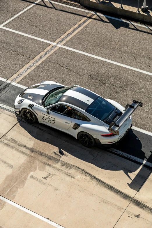 an overhead view of a sports car parked in a parking lot