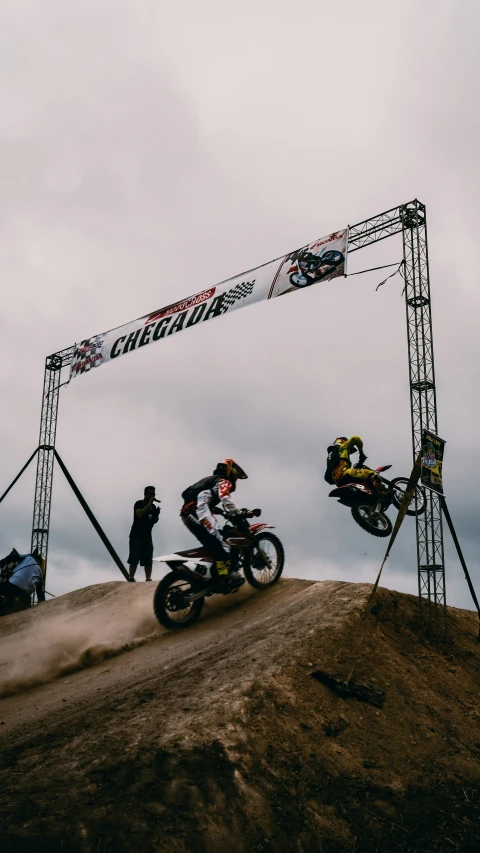 a man that is on a motorcycle in the dirt