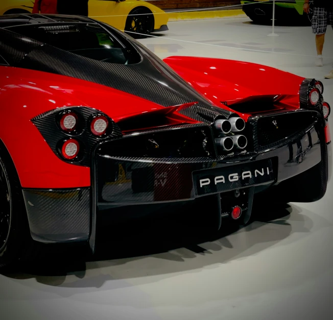 the sport car is parked on the show floor