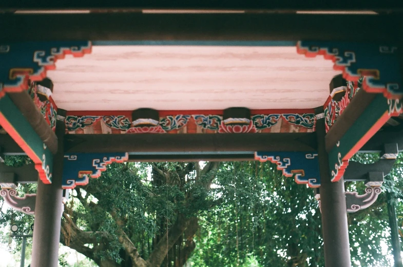 oriental styled pavilion style structure under large trees