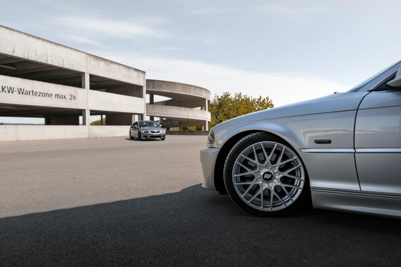 the wheels and rims of a silver car are shown