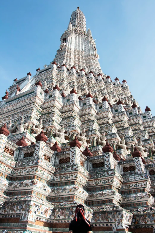 a person takes a picture of the inside of an intricately decorated temple