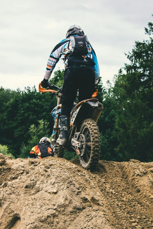 a man is riding on a dirt bike