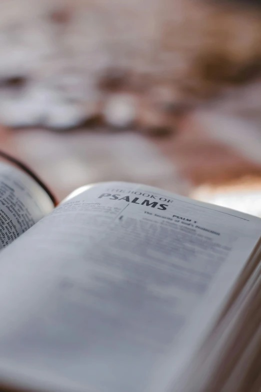 an open book laying on a wooden table