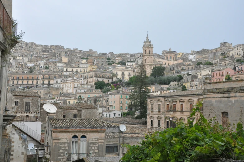 a city view is shown with buildings on the hill