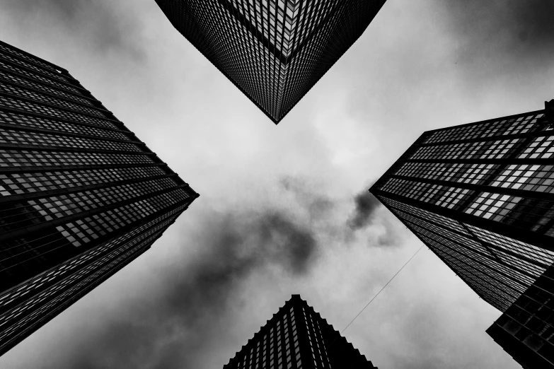 a black and white picture of three buildings