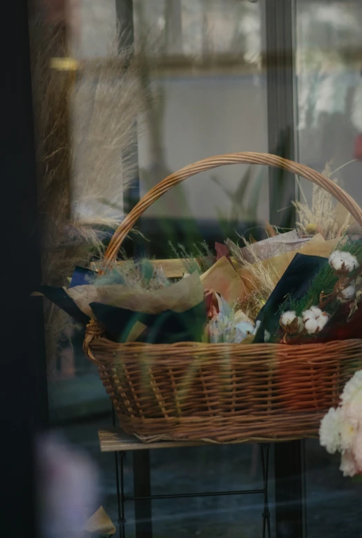 there is a basket on the table with a stuffed bear