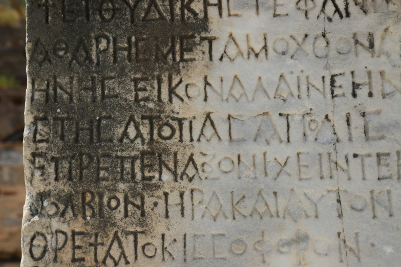 an ancient inscription on a wall in some type of writing