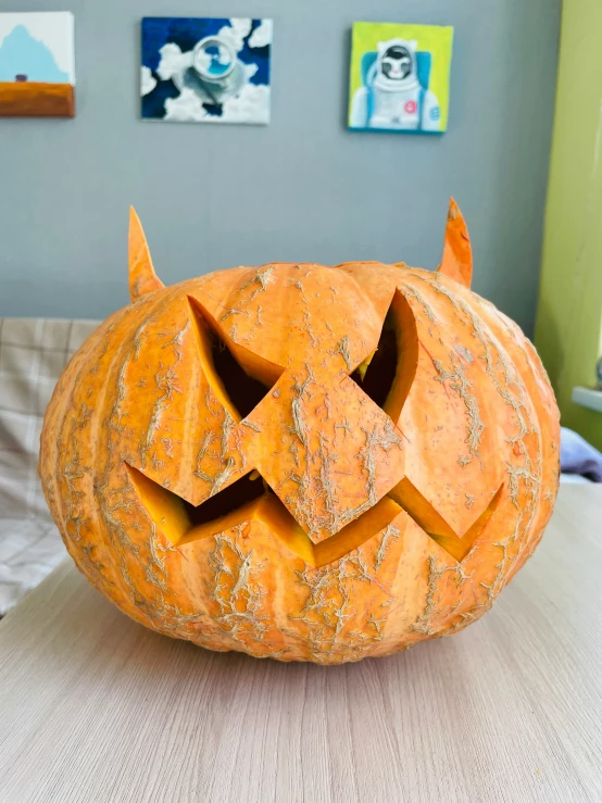 the carved pumpkin is made to look like it has been carved to look like a devil