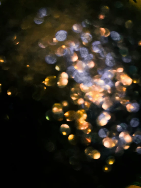 the reflection of rain on a window at night