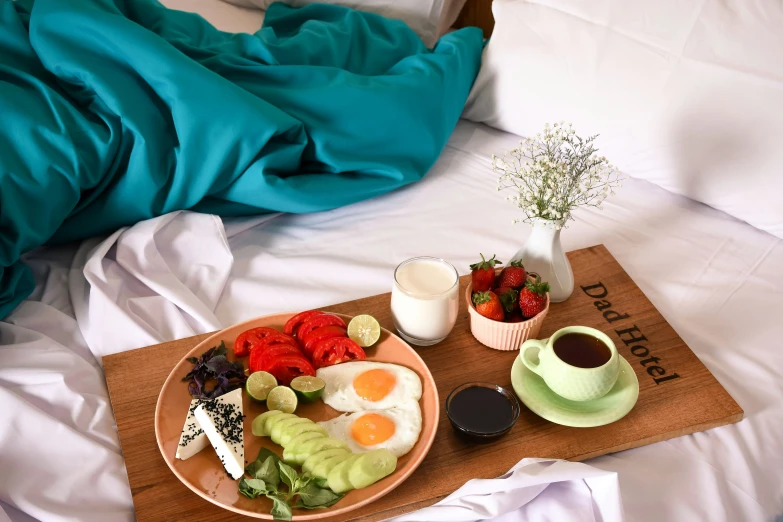 a tray with plates and bowls filled with breakfast food