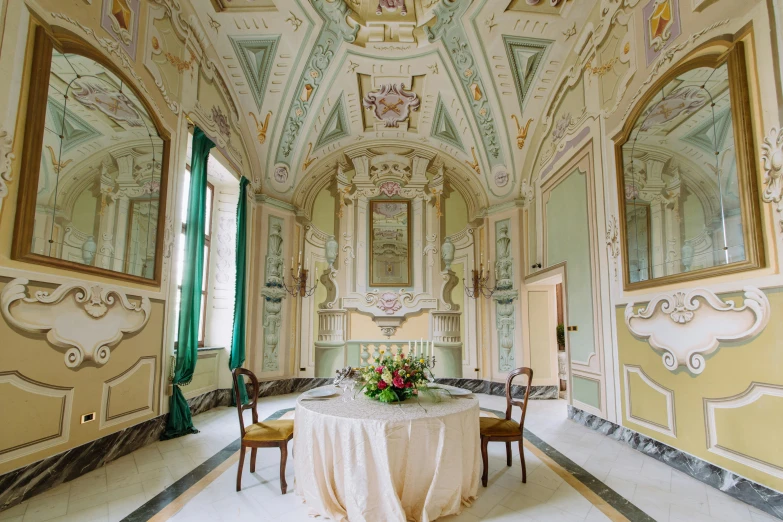 an elaborately decorated hallway with tables and chairs