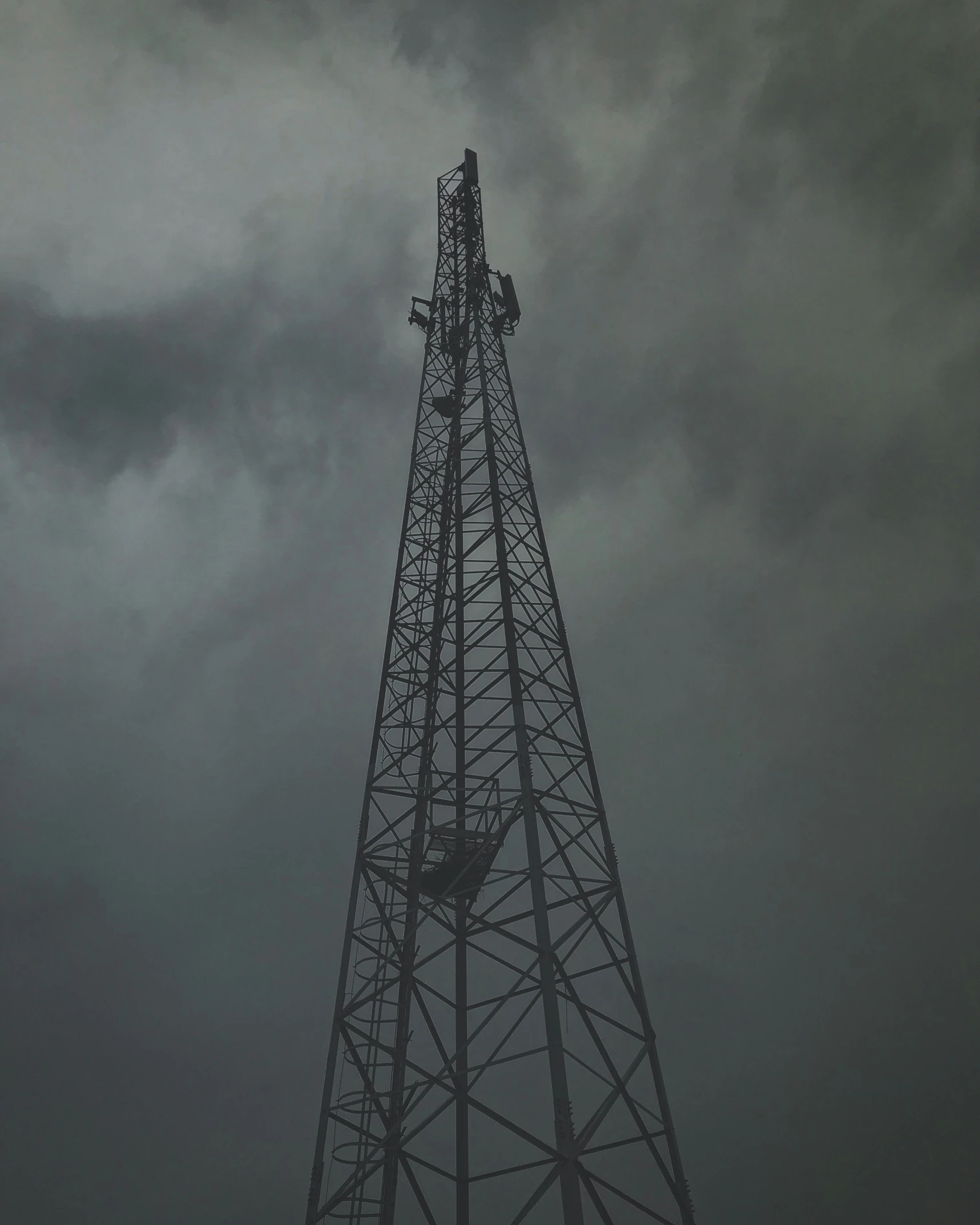 a cell tower with several antennas on top of it