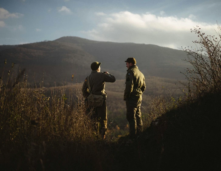 two people in the wilderness looking at soing