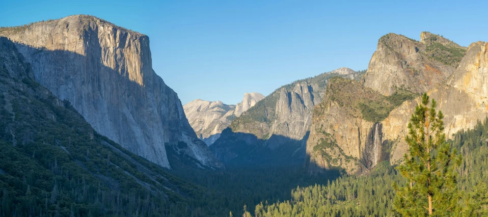 some very large mountains near by some trees